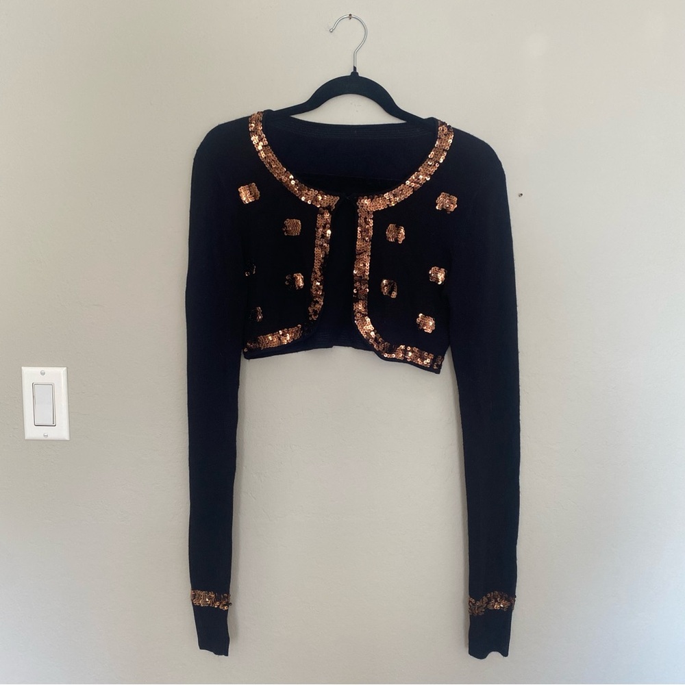 Cropped black cardigan with copper sequins.